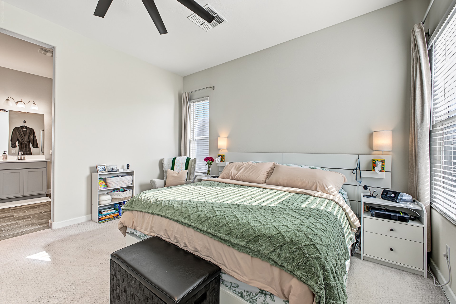 Interior — primary bedroom with en-suite and ceiling fan